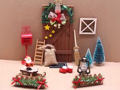 a table topped with christmas decorations and figurines