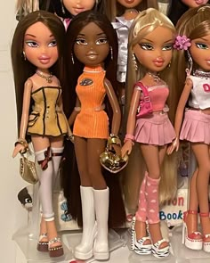 a group of dolls standing next to each other