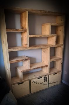 the shelves are made out of wooden boxes