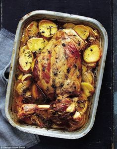 a roasting pan filled with chicken and potatoes