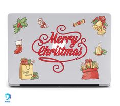 an image of a laptop with christmas decorations on the cover and merry christmas written in red