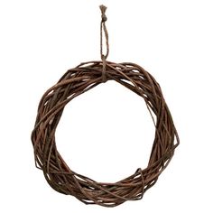 a brown wreath hanging from a rope