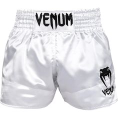 the venum boxing shorts is white with black lettering on it and an elephant logo