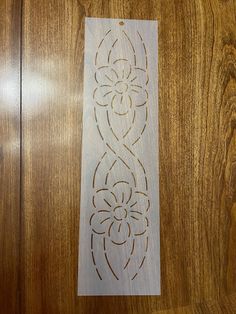 a piece of wood that has been carved into the side of a door with an intricate design on it