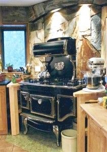 an old fashioned stove in a rustic kitchen