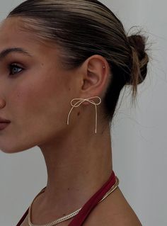 Gold-toned earrings Bow design, stud fastening Princess Polly Lower Impact 100% reclaimed brass  For hygiene reasons, this item cannot be returned Festival Shop, Gold Branding, Fleece Dress, Bow Design, Outerwear Outfit, Princess Polly, Tops Fall, Heeled Loafers, Wedding Hair And Makeup