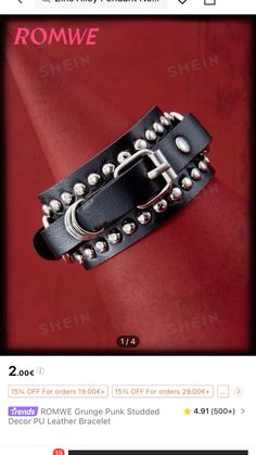 a black leather bracelet with silver studs on the side and an advertise