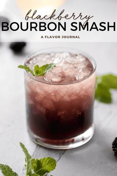 the blackberry bourbon smash is served in a glass with ice and mint garnish