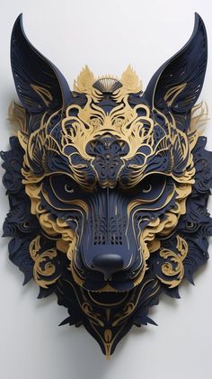 a paper sculpture of a wolf's head made out of gold and black paper