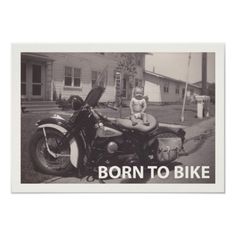 a black and white photo of a baby sitting on a motorcycle with the words biker babe