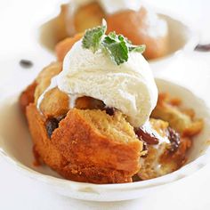 a small white bowl filled with food on top of a table