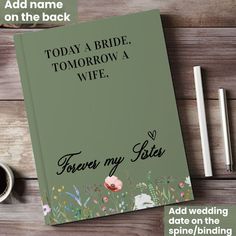 a wedding guest book on a table with coffee and pen to write the bride's name