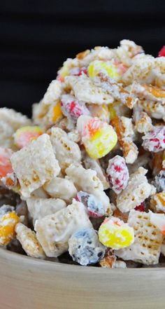 a wooden bowl filled with cereal and candy