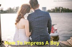 a man and woman sitting next to each other on a dock with the words how to impress a boy