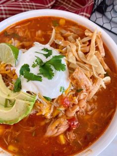 a white bowl filled with chicken tortilla soup