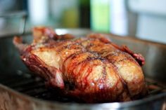 a piece of meat sitting on top of a grill