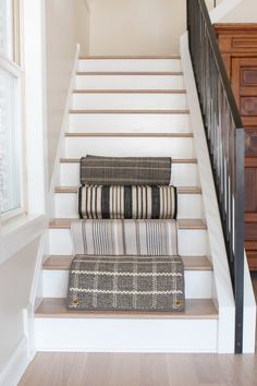 the stairs are lined with pillows and rugs