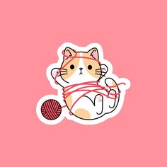 a sticker with a cat holding a ball of yarn in it's paws