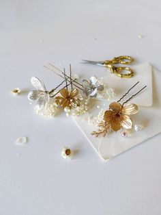 Glam wedding flower hairpins in gold and silver color The hairpins are made of artificial flowers, preserved material, beads and other arranging material. When stored in dry and dark place, our products last 10-15 years...  We can also make you other matching accessories. Please message me for more information. :) ---------------------------------------------------------------- SHIPPING INFO FOR EU ORDERS: Standard shipping: Your package will arrive in about 5-8 days after it has been shipped. Gold And Silver Hair, Wedding Bridal Hair, Wedding Couture, Silver Hair Clip, Floral Hair Pins, Bridal Hair Accessory, Hair Wreaths, Gold Hair Accessories, Gold Clips