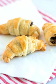 two croissants laying on the floor next to each other