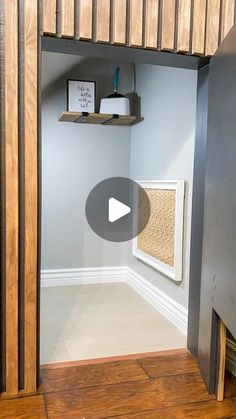 the inside of a room with wood floors and shelves on the wall, in front of an open door