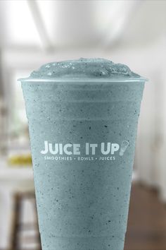 a blue cup with juice it up written on the side