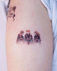 three harry potters tattoo on the right side of the thigh with a balloon flying above them