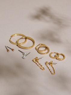 Add everyday staples to your jewelry collection with this variety pack featuring studs, hoops, and dangle earrings, all dipped in fine 18K gold. Jewelry Photography Styling, Photography Styling, Jewelry Photography, Gold Dipped, Accessories Jewelry Earrings, Altar'd State, Variety Pack, Gold Hoop, Earring Set