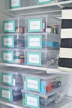 an organized refrigerator with plastic containers and labels