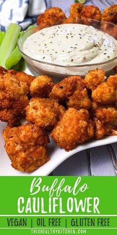 buffalo cauliflower is served with ranch dip and celery on the side