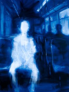 a blurry image of a person sitting on a bus