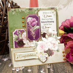 a close up of a greeting card with flowers