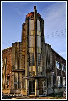 an old building that is very tall and has many windows on it's side