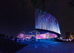 the building is lit up with colorful lights