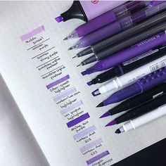 several pens are lined up on top of a page in a notebook with the names of each pen