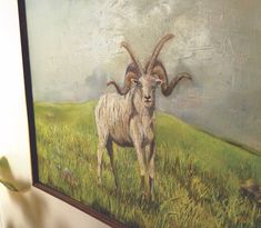 a painting of a goat standing on top of a grass covered field next to a wall