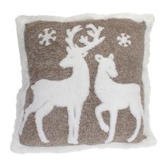 a brown and white deer pillow with snowflakes on it