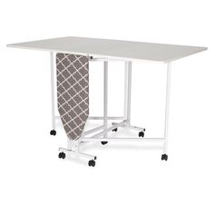 an ironing board on wheels is attached to a table with a cloth hanging from it