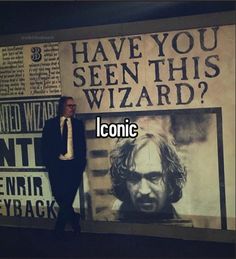 a man standing in front of a poster with the words have you seen this wizard?