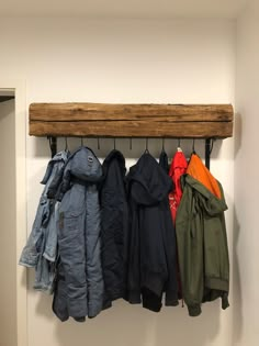 a coat rack with coats hanging on it