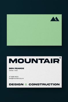 two business cards designed to look like mountains and the words mountain on them are black, green, and white