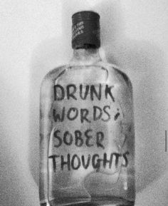 a glass bottle with writing on it that says drunk words sobr thoughs in black and white