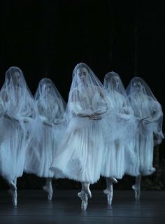 dancers in white tulle skirts and veils