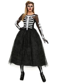 a woman wearing a skeleton costume with long sleeves and black tulle skirt, standing in front of a white background