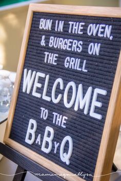 a sign that says, bun in the oven and burgers on the grill welcome to the bbq