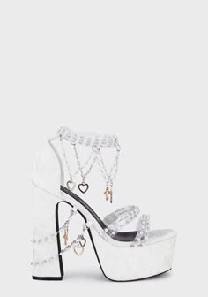 Free, fast shipping on Holy Revelation Platform Heels - White at Dolls Kill, an online boutique for kawaii fashion. Shop our exclusive collection of Sugar Thrillz clothing, shoes, and accessories here. Dollskill Shoes White, Heels With Charms, White Velvet Heels, Dolls Kill Shoes Platform, White Heels For Wedding, Dollskill Heels, White Pearl Heels, Dollskill Shoes