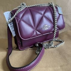 Coach Cj526 Mini Klare Puffy Diamond Quilt Crossbody Deep Berry Handbag Leather Nappa Leather And Smooth Leather Inside Multifunction And Zip Pockets Snap Closure, Fabric Lining Outside Open Pocket Handles Convert To Shoulder Strap With 22" Drop 7" (L) X 5 1/4" (H) X 2" (W Coach On-the-go Flap Bag, Coach Flap Bag For On-the-go, Coach Flap Bag For Everyday Use, Coach Quilted Shoulder Bag For Everyday Use, Quilted Crossbody Shopping Bag, Coach Quilted Leather Bag, Coach Crossbody Bag With Chain Strap, Purple Leather Shoulder Bag With Chain Strap, Coach Rectangular Shoulder Bag With Chain Strap