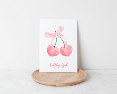 a card with two cherries on it and the words happy birthday girl written in pink ink