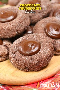 chocolate thumbprint cookies on a wooden plate