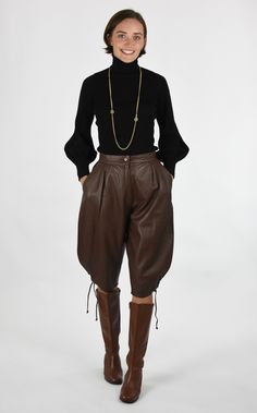 "DESCRIPTION Fabulous Vintage 80's Rich Brown Leather Knickerbocker Trouser Pants These are Fabulous and So On Trend at the Moment! Made from a Dark Brown Soft Leather with a Fitted Waistband with Zip and Single Button Closure.  Front has Pleats and Side Pockets with Darts at Back for Shape. Legs Balloon Out at Sides and Taper in to Knee with Side Vents with Six Metal Eyelets and Leather Ties at Sides. Lined in a Brown Acetate Fabric. Knee Length depending on height. DETAILS: Fabric : Leather Label : Gigi Pary Era : 1980's Condition : Good with a slight mark on waistband from a coathanger MEASUREMENTS: Waist : 24\"- 25\" Hip : Up to 48\" due to style Inseam : 15\" Length : 27\"  Dry Clean" Lederhosen Outfit, Leather Pants Outfit, Balloon Pants, Leather Pants Women, Leather Label, Trouser Pants, Pants Outfit, Vintage Leather, Trousers Women